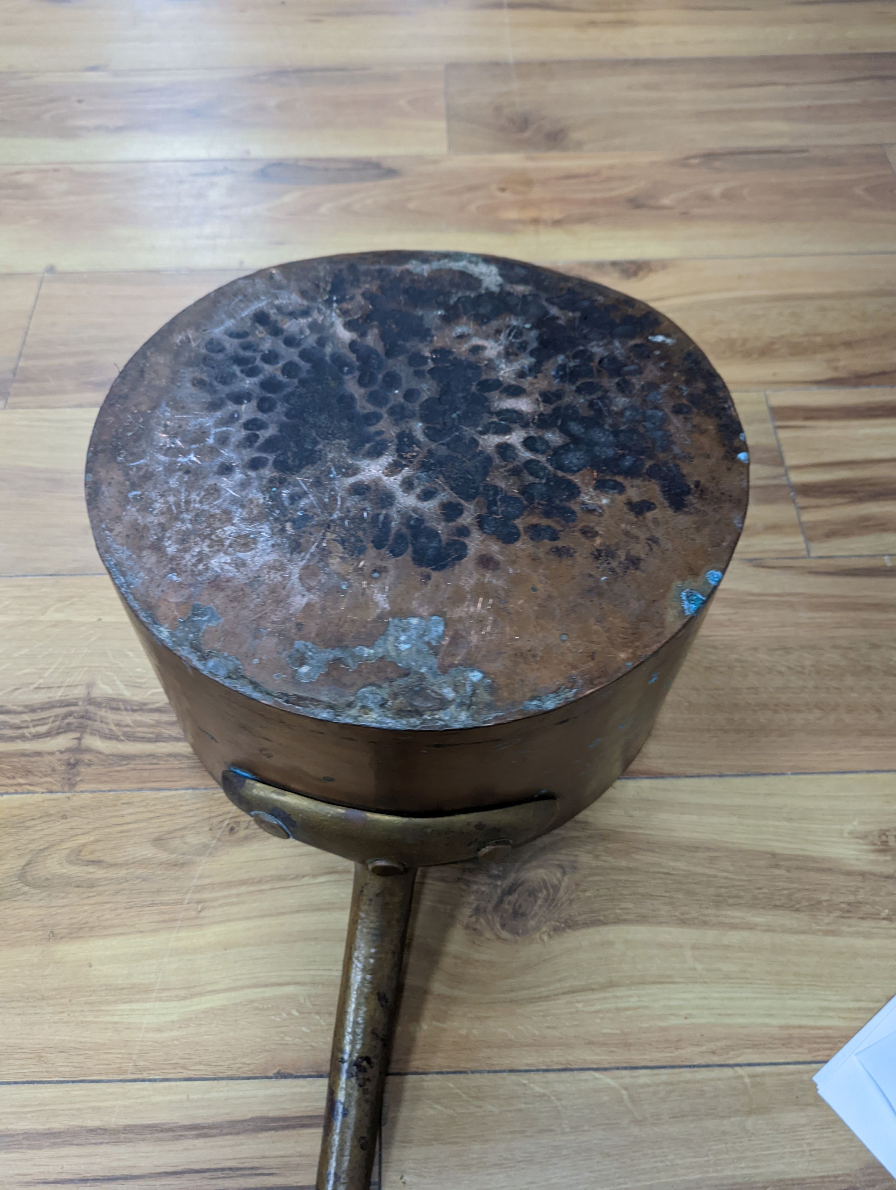 A group of three Jaeggi & Sons copper saucepans